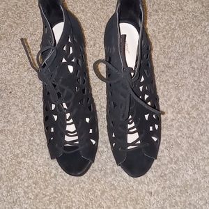 All black with unique cut out, high heels.  The brand are APT.9